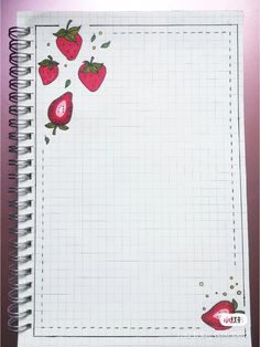 an open notebook with strawberries on it