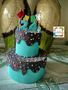 a three tiered birthday cake decorated with polka dots