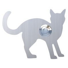 a white cat is standing in the shape of a doorknob with a button on it's side