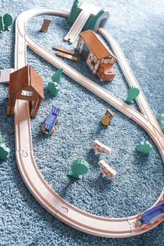 a toy train set is shown on the carpet