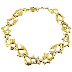 YVES SAINT LAURENT vintage gold toned necklace featuring fish links. Embossed YSL Made in France. Numbered E0. Indicative measurements : adjustable length from approx. 46 cm (18.11 inches) to approx. 50 cm (19.69 inches) / width approx. 2.7 cm (1.06 inches). JEWELRY CONDITION CHART - New or never worn : item is in pristine condition with no noticeable imperfections - Excellent : item has been used and may have not more than two minor imperfections - Good : item has been used and may have more th Westwood Necklace, Ysl Vintage, Saint Laurent Vintage, Simple Silver Jewelry, Fish Jewelry, Fish Necklace, Vintage Fishing, Floral Necklace, Themed Jewelry