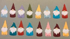 several paper gnomes with names on them