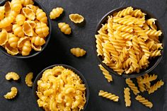 three black bowls filled with macaroni and cheese