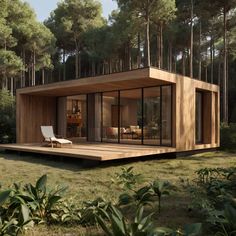 a small wooden house in the middle of a forest with lots of trees around it