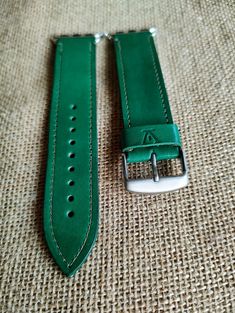 Handmade Leather Watch Strap for Apple watches These elegant watch straps are made from the highest quality leather, twin layered and stitched for a robust construction. Each one hand made with care and attention to produce a stunning, stylish and classic looking accessory. ⟡ A delightful vivid green with olive stitching. ⟡ Each strap has a wearable length of 18.5cm to 23.5cm (7.28 to 9.25 inches) once fitted onto your Apple Watch. ⟡ 38/40/41mm size option has a 22mm strap and buckle. ⟡ 42/44/45 Luxury Green Leather Strap Watch Bands, Green Leather Watch Bands For Everyday Use, Handmade Green Watch Bands For Everyday Use, Classic Green Leather Watch Band, Green Leather Watch Bands With Bracelet Strap, Leather Watch Strap, High Quality Leather, Watch Strap, Apple Watch