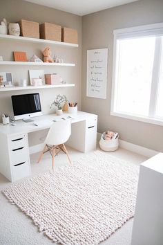 a white desk and chair in a small room with shelves on the wall above it