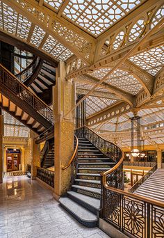 the inside of a building with many stairs and railings on each side of it