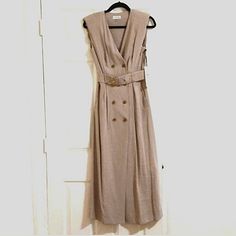 New With Tags! Calvin Klein Brings Us Classic Style With This Gorgeous Sleeveless Trench Maxi Dress! It Features A Matching Belt With Stylish Gold Buckle, Light Padding In The Shoulders And Double Breasted Buttons Down The Front. Perfect For A Day At The Office Or Lunch Out With Friends! Great For Fall! Brand New! Never Worn! -Classic Beige (Ck Calls It "Mur") -Size 4 -90% Rayon / 10% Polyester -Sleeveless -Belted With Gold Buckle Sleeveless Belted Day Dress, Casual Sleeveless Belted Midi Dress, Sleeveless Belted Spring Dress, Spring Sleeveless Belted Dresses, Chic Belted Sleeveless Dress, Sleeveless Beige Belted Midi Dress, Calvin Klein Sleeveless Midi Dress For Summer, Calvin Klein Fitted Sleeveless V-neck Dress, Calvin Klein Fitted V-neck Sleeveless Dress