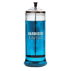 a blue glass jar with a metal lid and handle on the top that says barbique