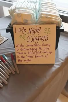 there is a sign that says late night diapers and some crayons on the table