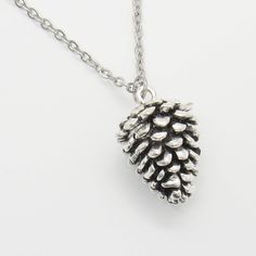 "Large Pine Cone Pendant, Antique Silver Tone, Men's Necklace, Women's Necklace, Christmas Jewelry, Mountain Nature Jewelry, Holiday Necklace This 3Dimensional Pine Cone Pendant is 1-3/8\" high x 7/8\" wide x 7x8\" deep STAINLESS STEEL CHAINS - Hypo Allergenic, Resist Tarnishing Flat Link Chain, 4 x 3mm, Stainless Steel Chain, Lobster Clasp Twist Curb Chain, 4.6 x 3.3 x 0.6mm, Stainless Steel Chain, Lobster Clasp Ball Chain, 2.4mm, Stainless Steel Chain, Ball Connector Rolo Chain, 3 x 1mm, Stain Nickel-free Silver Necklaces For Christmas, Nickel-free Silver Necklace For Christmas, Pine Cone Pendant, Pine Cone Necklace, Cartouche Necklace, Pinecone Necklace, Green Aventurine Necklace, Pinecone Pendant, Grunge Jewelry