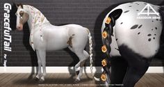 a white and black horse standing next to a brick wall with orange flowers on it's mane