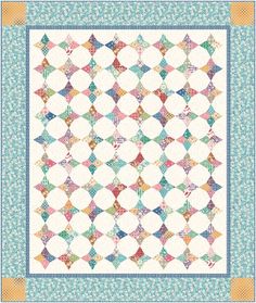 a colorful quilt with an intricate design on the front and side, in shades of blue