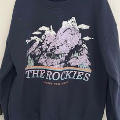 New Never Worn With Tags The Rockies Blue Winter Tops With Text Print, Winter Blue Tops With Text Print, Blue Text Print Top For Winter, Blue Text Print Tops For Winter, The Rockies, Graphic Sweatshirt, Color Blue, Sweatshirts Hoodie, Tags