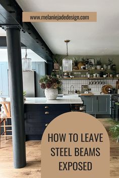 a kitchen with blue cabinets and white counter tops is featured in the article how to leave steel beams exposed