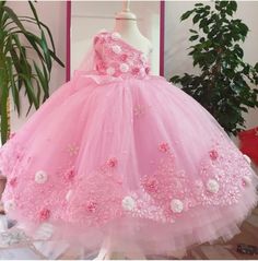 This dress will be the perfect choice for your little one's special day, whether it be a birthday, christening or first holy communion. The beautiful color dress is contrasted with detail and complimented by a bridal look. - - and completely lined in the softest silk chiffon, this is a truly luxurious and elegant pink dress. If your baby girl loves pink then why not make her feel extra special on her special day? This beautiful dress is made with much love for your lovely kid. It is perfect for special occasions, birthday parties, photo shooting for babies, cake smash photo shooting, and any kind of formal event. Made here in the USA!! As a mother, buyer comfort for our kids is most important. Looking fancy and at same time comfortable is the match I am trying to apply to my designs. The d