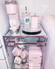 a shelf filled with lots of pink items