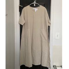 Linen Blend Dress, One Size Fits All. Never Worn! In Perfect Condition But I Was Too Lazy To Steam! :) No Longer Sold Online. Pit To Pit Measurement 22.75”, Length From Shoulder To Hem 46”. Casual Cream Short Sleeve Maxi Dress, Neutral Cotton Short Sleeve Dress, Casual Cream Maxi Dress With Short Sleeves, Neutral Short Sleeve Midi Dress For Beach, Neutral Short Sleeve Midi Dress For Daywear, Neutral Short Sleeve Maxi Dress For Summer, Neutral Short Sleeve Summer Maxi Dress, Beige Short Sleeve Summer Maxi Dress, Oversized Neutral Summer Dress