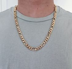 14k Gold Figaro Chain for Men, Gold Figaro Chain Necklace, 9mm Figaro Chain, High Quality Necklace  14k Heavy Plated Gold, Lifetime Replacement Guarantee! QUALITY  We plate our chains with a heavy layer of 14k gold ranging in thickness from 26 mils to 76 mils depending on the style and size of the base chain. We find these thicknesses to be extremely durable. All of our plating is done in the USA. Under normal wearing conditions and with proper care, our gold plated chains should maintain their Luxury Gold Plated Figaro Chain Jewelry, Luxury Gold Figaro Chain Necklace, Luxury 14k Gold Figaro Chain Necklace, Figaro Chain, Yellow Gold Plated Figaro Chain Necklace, Luxury Gold-tone Figaro Chain Jewelry, Gold-tone Figaro Chain Necklace, Luxury Gold-plated Figaro Chain Necklace, Cuban Chain Men