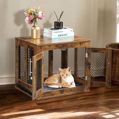 an orange and white cat sitting in a caged end table