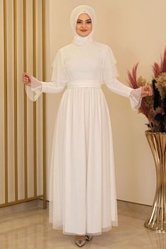 Our dress is made of tulle fabric and its length is 150 cm. It can be used comfortably in all seasons. Long Sleeve Organza Evening Dress For Banquet, Long Sleeve Organza Gown For Banquet, Floor-length Dress With Sheer Sleeves For Banquet, Long Sleeve Organza Dress For Banquet, White High Neck Dress For Party, White Maxi Length Gown For Banquet, White Organza Gown For Party, White Organza Party Gown, Elegant High Neck Maxi Dress For Wedding