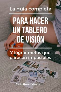 a woman sitting on top of a couch next to a table filled with pictures and cards