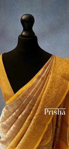 Gold Katan tissue silk saree with copper zari floral pattern weaving all over the body of the saree. The saree has a yellow contrast border and pallu with intricate copper zari weaving.  Blouse: Yellow brocade material  [Unstitched] Please note there may be slight colour variations due to lighting. please send us a message if you want blouse material separated  and need pico ( no extra charge) Gold Brocade Pre-draped Saree With Zari Weaving, Gold Brocade Pre-draped Saree With Zari Work, Yellow Brocade Traditional Wear With Cutdana, Yellow Cutdana Brocade Traditional Wear, Yellow Brocade Traditional Wear For Festivals, Transitional Yellow Pre-draped Saree With Pallu, Elegant Yellow Tussar Silk Blouse Piece, Yellow Self Design Blouse For Transitional Season, Gold Bollywood Brocade Saree