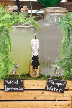 there are two jars with lemonade and water in them on the wooden pallet