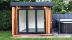 an outdoor sauna is shown in the yard