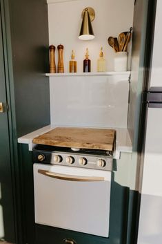 a kitchen with an oven, stove and counter top in it's center area