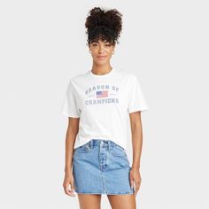 Upgrade your casual wear collection with the Women's Game Day American Flag Short Sleeve Graphic T-Shirt – White. Features ‘Season of Champions’ on the front that gives a cool, fun vibe. Made of soft cotton material with jersey fabric, it makes it easy to wear throughout the day. Wear this tee with your favorite pair of jeans for a weekend getaway or a casual outing with friends. Nicki Minaj Pink Friday, American Flag Shorts, Cool Graphic Tees, Hem Style, Weekend Getaway, Shirt White, Game Day, Jersey Fabric, American Flag