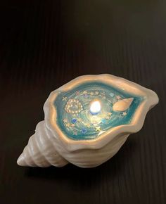 a candle that is inside of a shell