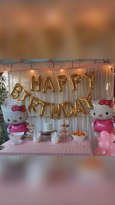 a hello kitty birthday party with balloons and food