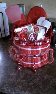 a red basket filled with lots of items on top of a counter