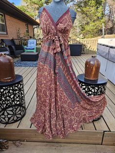 "This is a beautiful empire waist maxi dress , one of a kind handcrafted from vintage silk . Has a V neck , adjustable straps and smocked at the back . Measurement (appx): Bust:  36 \" with elastic waist stretch upto 42\" Height: 56 \"( measured from the shoulder line to the bottom ) ONE size fits most from S to L ,please refer to the measurements before purchasing . Has a tie by the bust for a chic look . Thank you looking , stay safe !" Bohemian V-neck Dress With Smocked Back, Casual Tie-back Floor-length Maxi Dress, Flowy Bohemian Dress With Empire Waist, Festival V-neck Sundress Maxi Dress, Bohemian V-neck Maxi Dress With Smocked Back, Bohemian Maxi Dress With Empire Waist For Vacation, Flowy Floor-length Maxi Dress With Tie Back, Bohemian Maxi Dress With Tie Back, Bohemian Empire Waist Maxi Dress For Beach