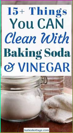 a glass jar filled with baking soda next to a pile of white towels on top of a wooden table