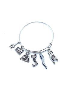 Italy themed charms are made from a zinc alloy metal  (lead and nickel free) Charms are approx 1/2" - 1" in size include Mano Cornuto (good luck) Italian Cornicello Horn (Hope and Good luck) Italy Map, Pizza, Roman Colosseum, wine bottle and glasses Expandable bracelet is made of steel is smooth and comfortable inside diameter is 2.5" May be personalized with Initial and or birthstone for extra please message me prior to purchase last 4 photos show personalization add $2.00 for Initial $3.00 for Expandable Bracelet, Italy Map, Zinc Alloy, Wine Bottle, Initials, Jewelry Bracelets, Italy, Charm Bracelet, Silver