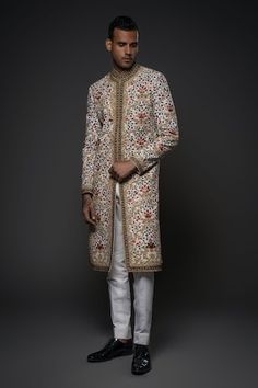 Ivory long sherwani with all over floral garden embroidery using resham thread in multi color tones. - Aza Fashions Designer Transitional Sherwani With Floral Embroidery, Designer Sherwani With Floral Embroidery For Eid, Transitional White Sherwani With Floral Embroidery, Designer Sherwani With Floral Embroidery, White Sherwani With Floral Embroidery For Eid, White Nehru Jacket With Floral Embroidery In Traditional Drape, White Nehru Jacket With Floral Embroidery, Designer Sherwani With Floral Embroidery For Reception, Designer Sherwani With Floral Embroidery For Wedding