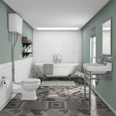 a bathroom with green and white walls, tiled flooring and a bathtub in the corner