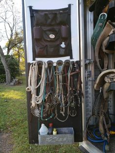 a horse trailer filled with lots of different types of tacks