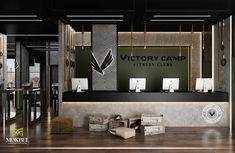 the front desk of victory camp fitness clubs, with boxes on the floor next to it