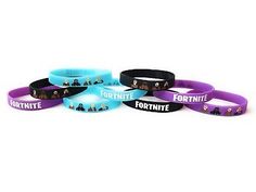 four wristbands with the words fortnite on them in purple and blue