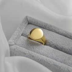 Circle Signet Rings14k Gold Plated Stainless SteelOur Signet Rings are the perfect marriage of elegance and charm. They make the perfect addition to any jewelry collection. These fashionable accessories are minimalist in make, yet timeless in style. The base of each Signet Ring is made with 14k Gold Plated Stainless Steel, allowing them to keep their color over time. All of our pieces are made with lightweight and hypoallergenic materials, allowing for easy, comfortable, all day wear.If you love Timeless Gold Stackable Rings As Gift, Simple 14k Gold Ring, 14k Gold Ring With Simple Design, Classic Formal Jewelry With Simple Design, Minimalist Classic Jewelry For Anniversary, Minimalist Gold Plated Dome Ring For Formal Events, Classic Couple Rings For Promise With Polished Finish, Minimalist Polished Couple Promise Rings, Classic Gold Plated Jewelry For Wedding