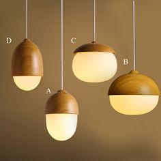 three wooden lights hanging from the ceiling