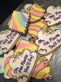 decorated cookies are arranged in the shape of hearts with words written on them that say oh, please you'll go