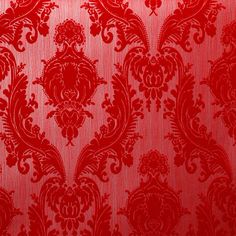 a red wallpaper with an ornate design