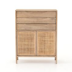 a wooden cabinet with wicker doors and drawers