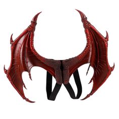 a red dragon headdress with large horns and sharp fangs on it's back