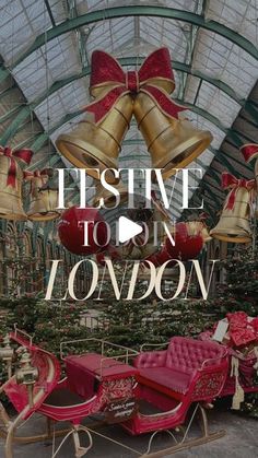 the inside of a building with christmas decorations and bells hanging from it's ceiling