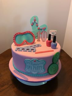 a birthday cake decorated with items from the spa party